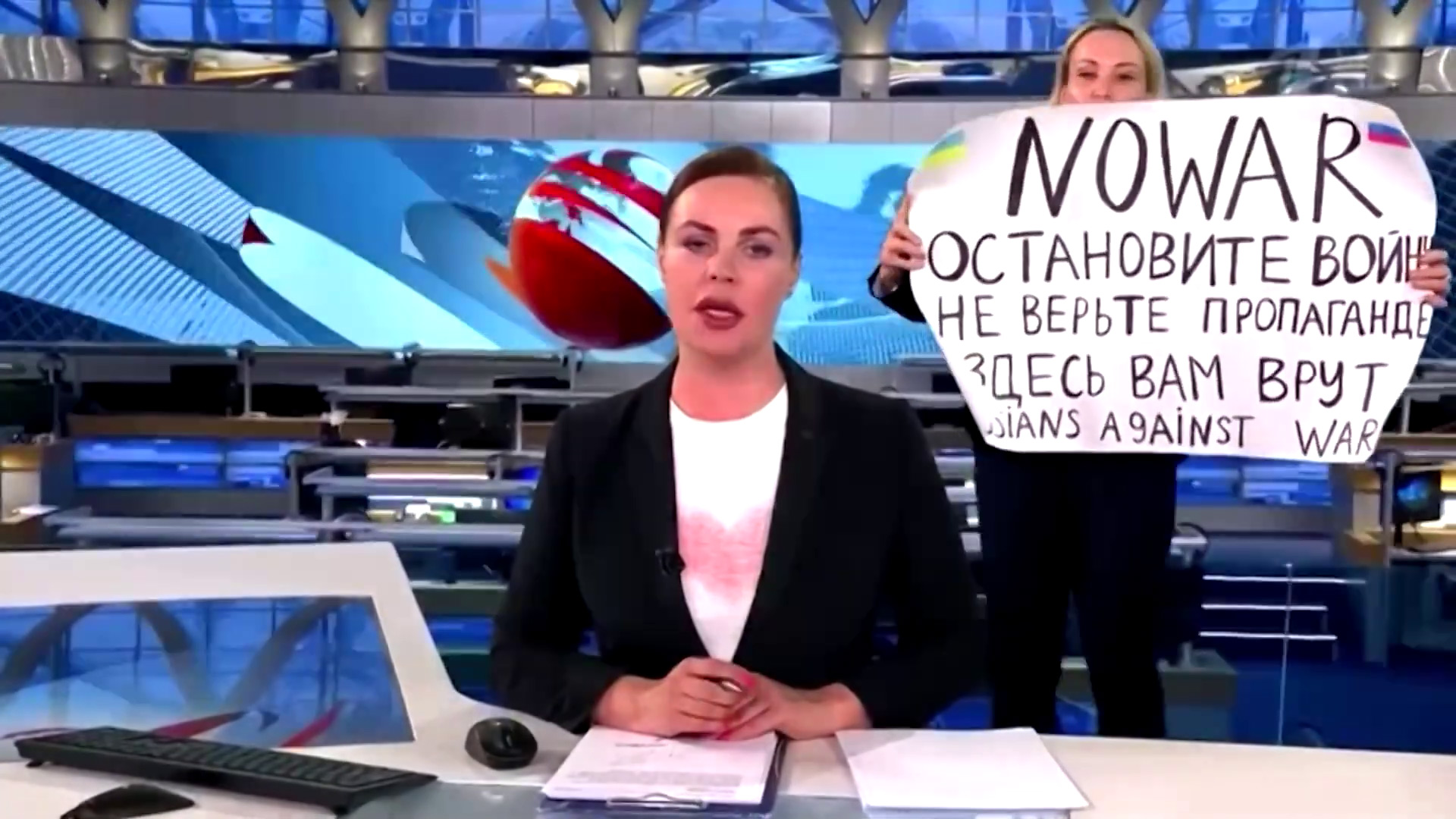 Woman protesting on Russian news broadcast